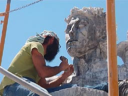 Irakli Chkhartishvili  is a young ,very hard working man from Georgia (Eastern Europe!). His 4.34 m statue made of grey marble showing :  HELIOS ... the ancient greek god of the sun